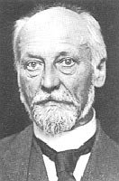 Porträtphotographie eines alten Ludwig Quidde mit Halbglatze und im Anzug.