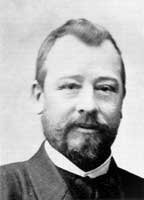 Porträtphotographie von Franz Josef Ehrhart im Anzug mit Bart.